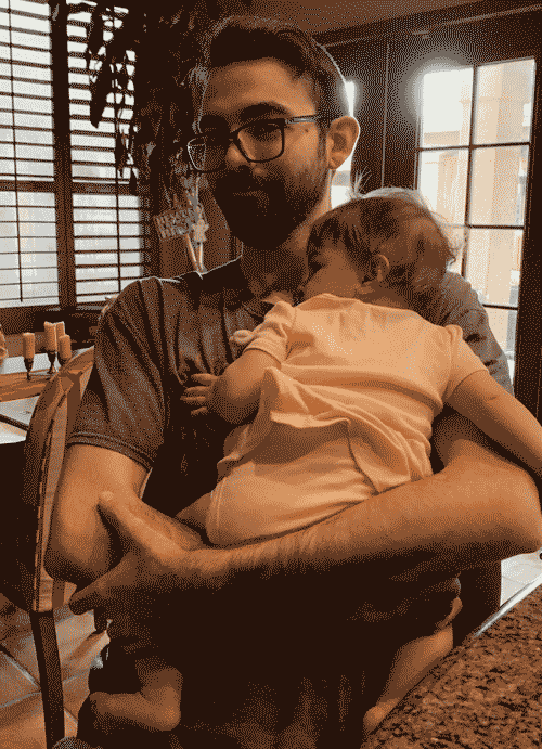 An unedited picture of man and baby